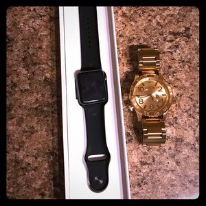 Gold Nixon watch and Apple Watch