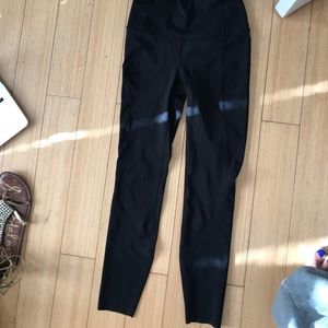 Black leggings with laser cutout on the calves.