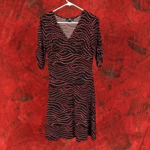 Black dress with red and white pattern.