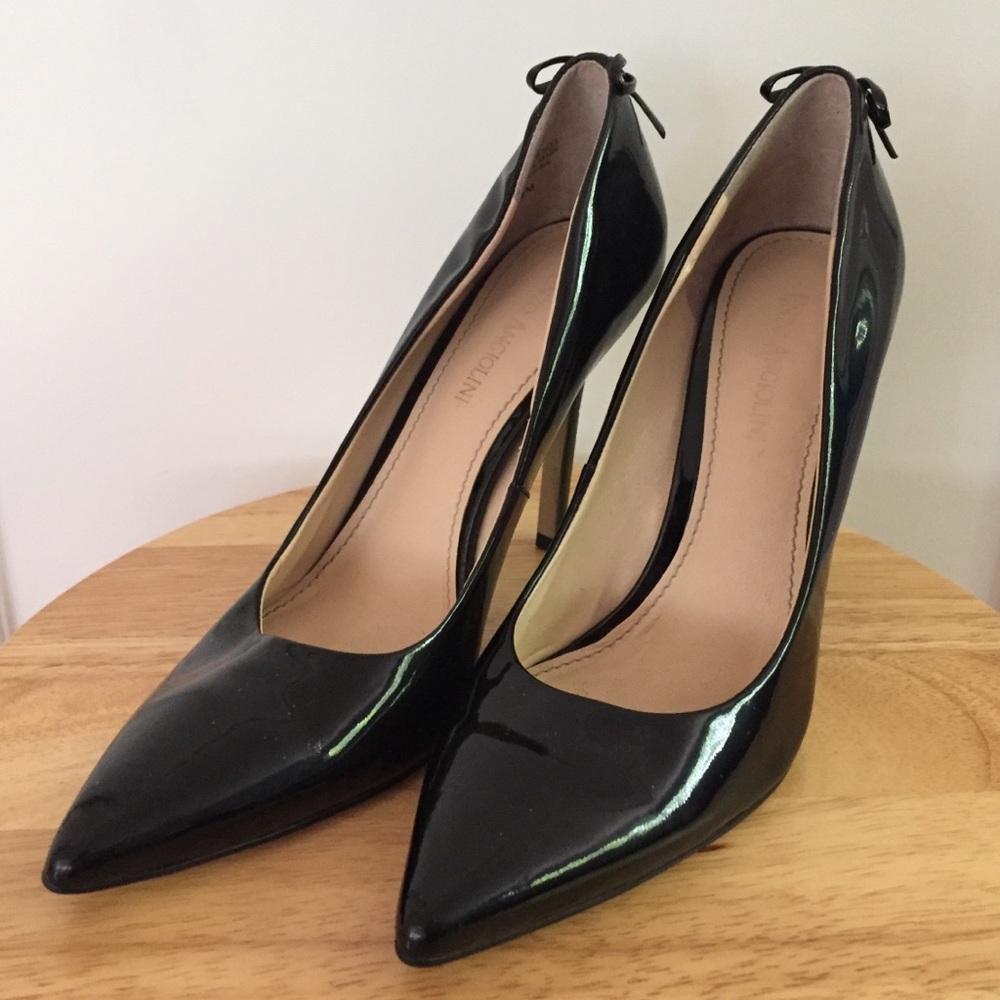 Corset back fetish patent leather stilettos.