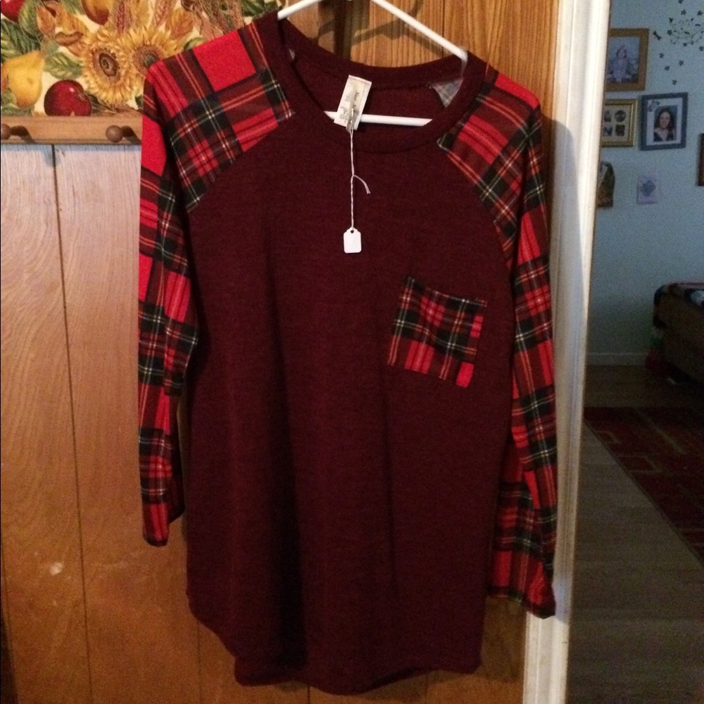 Never worn with tags Long sleeved pull over shirt