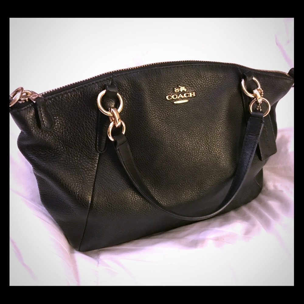 Black leather coach purse.