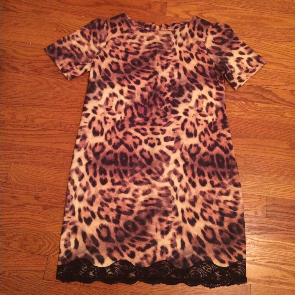 A cheetah print dress with a little black lace