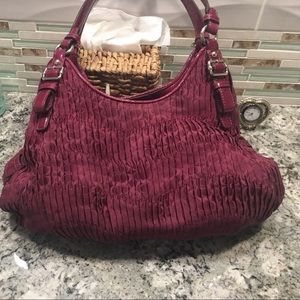 Coach material with leather handles