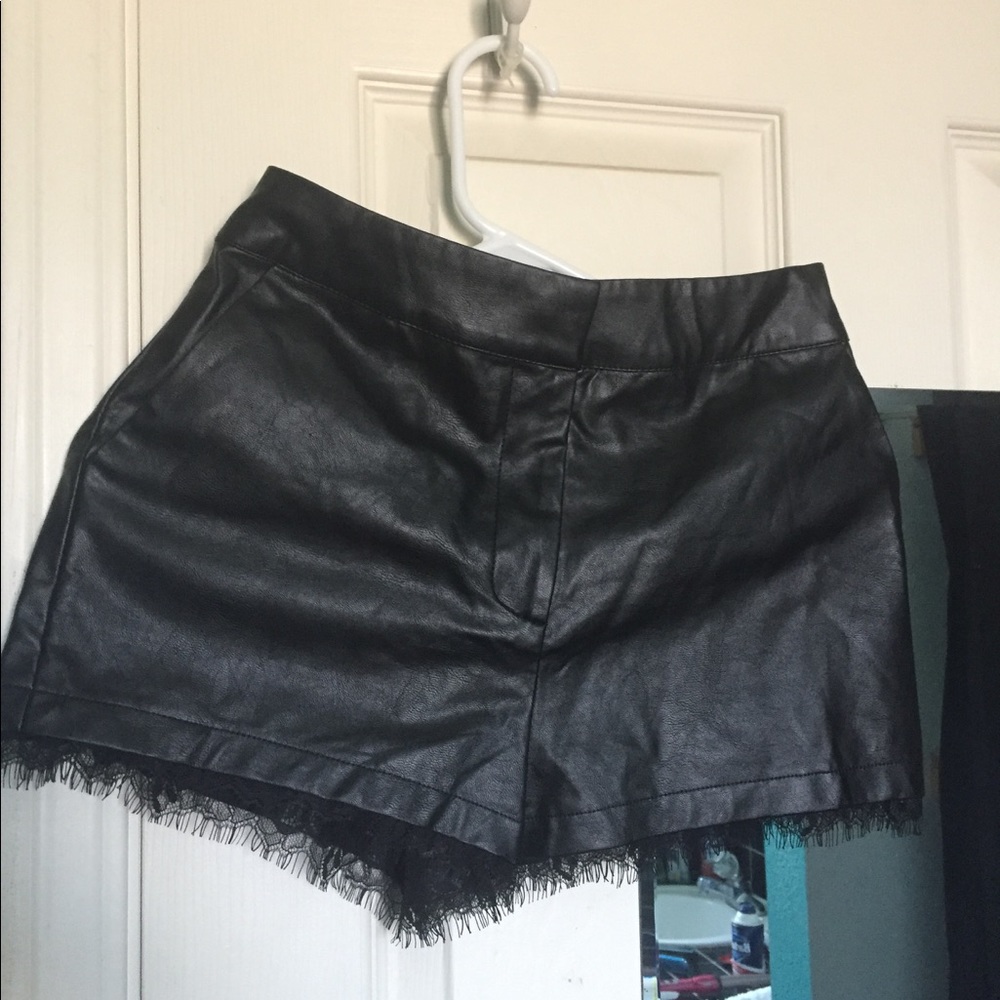 Black pleather shorts with lace trim