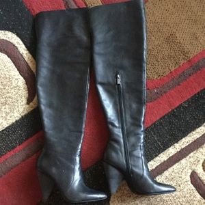 Thigh high leather boots.