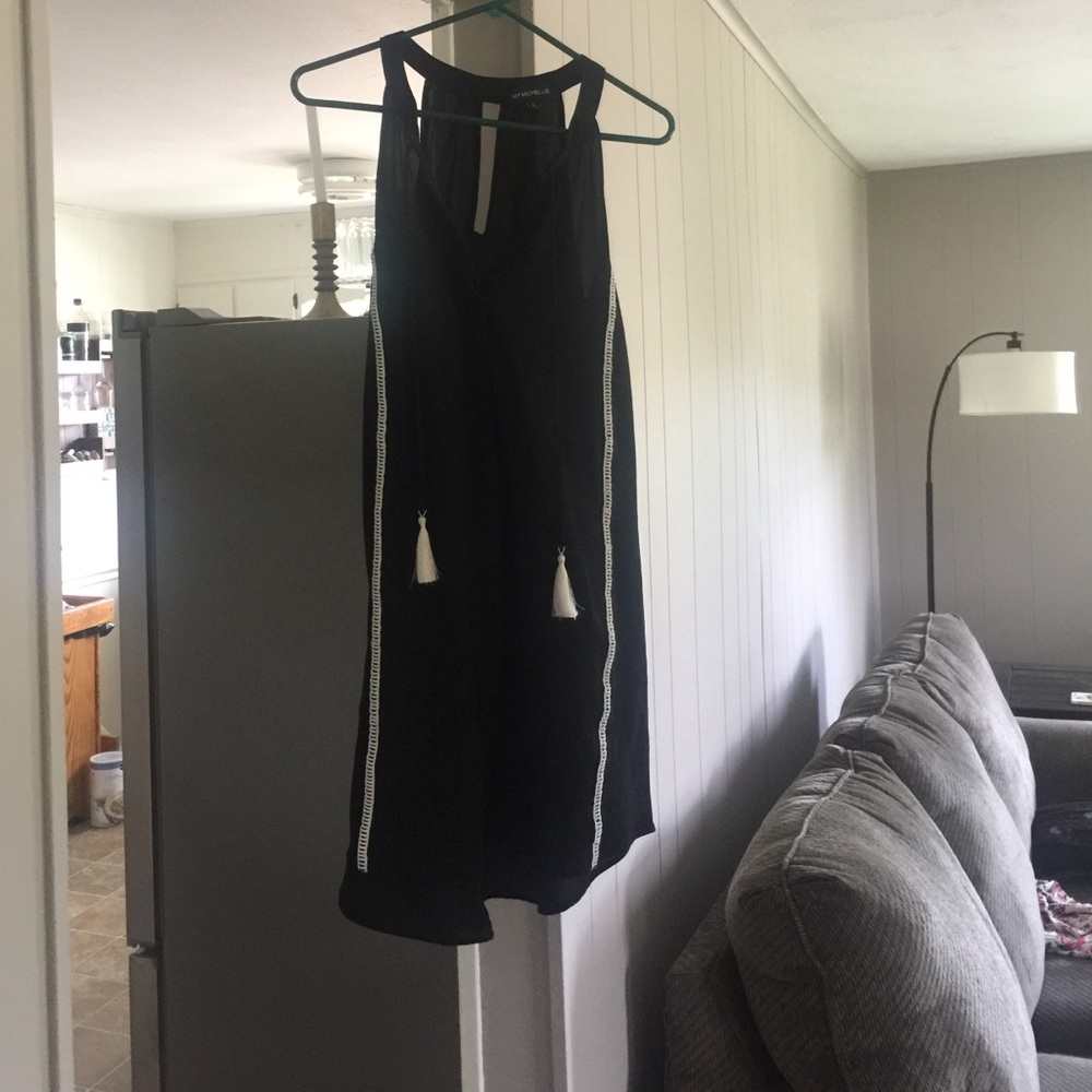 Black and white sleeveless dress with tassels