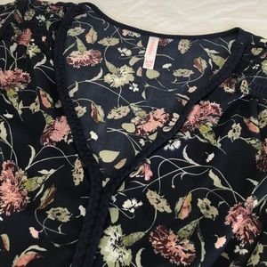 Floral peasant top with braided neckline Floral peasant top with braided neckline