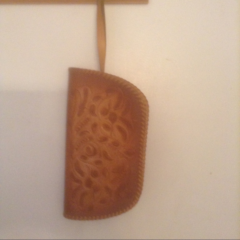 Leather stamped clutch/wristlet.