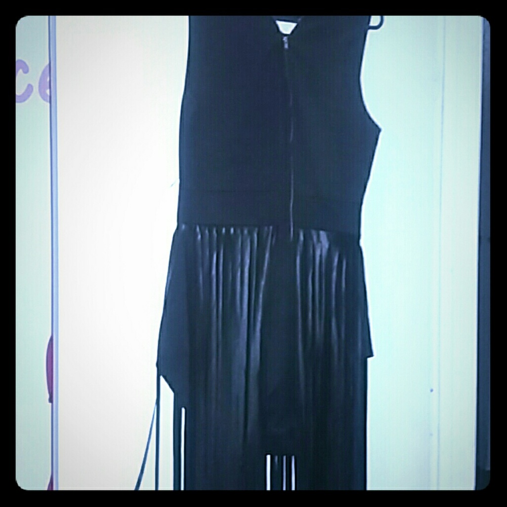 Onesie zip up in front and fringe that hangs to th
