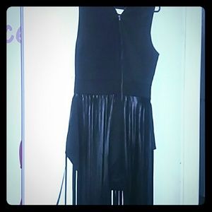 Onesie zip up in front and fringe that hangs to th