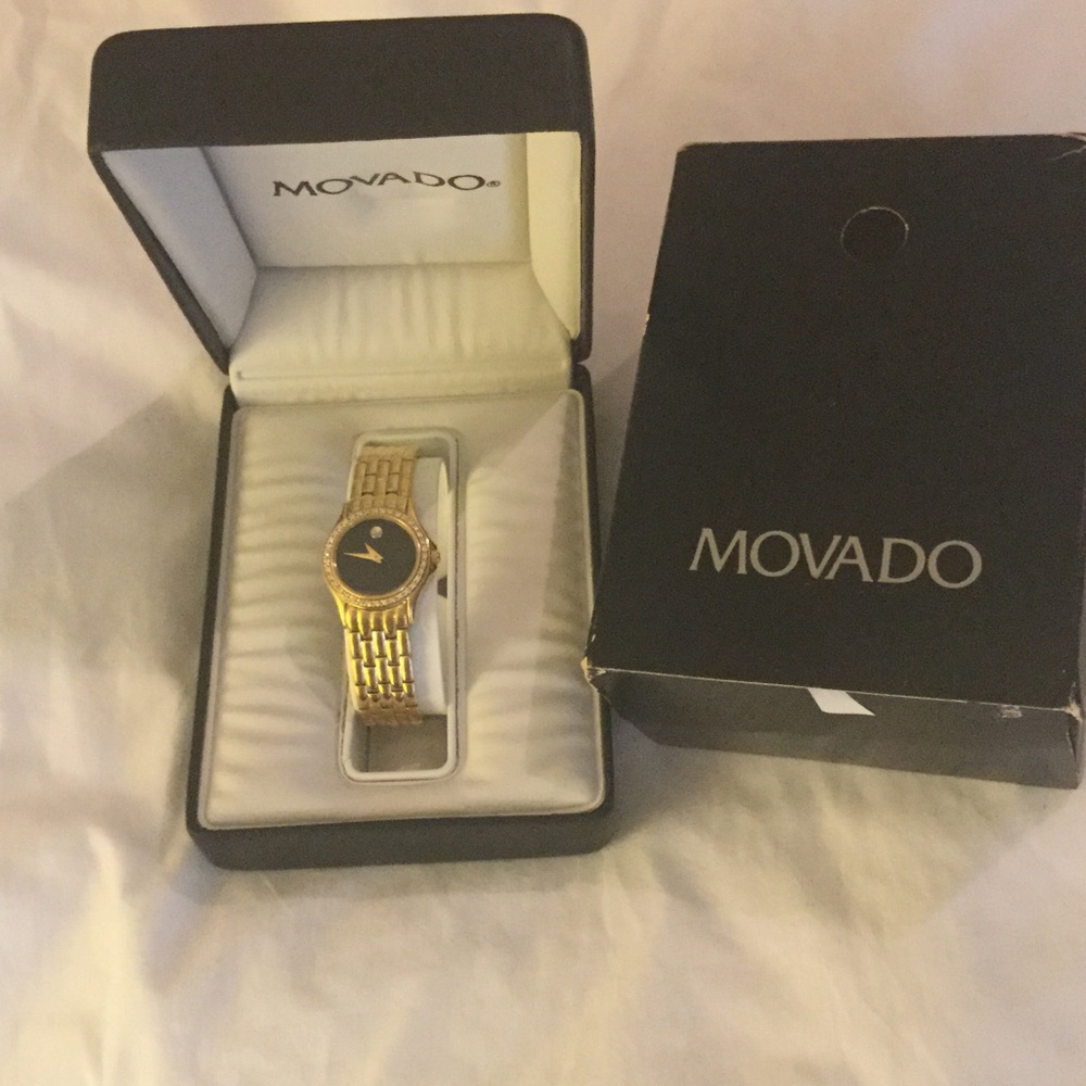 Woman's Movado diamond 14k gold watch