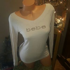 Bebe rhinestone logo V neck blouse L Bebe rhinestone logo V neck blouse L