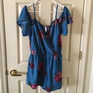 Blue romper. Never worn. Size L.