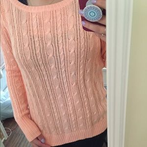 Small peach sweater