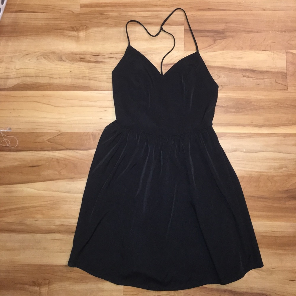 Size M spaghetti strap open black skater dress