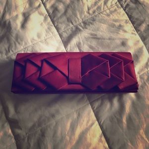 Wine Colored Multiple Bow Clutch