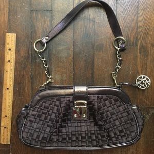 The SAK brown bag with metal accents