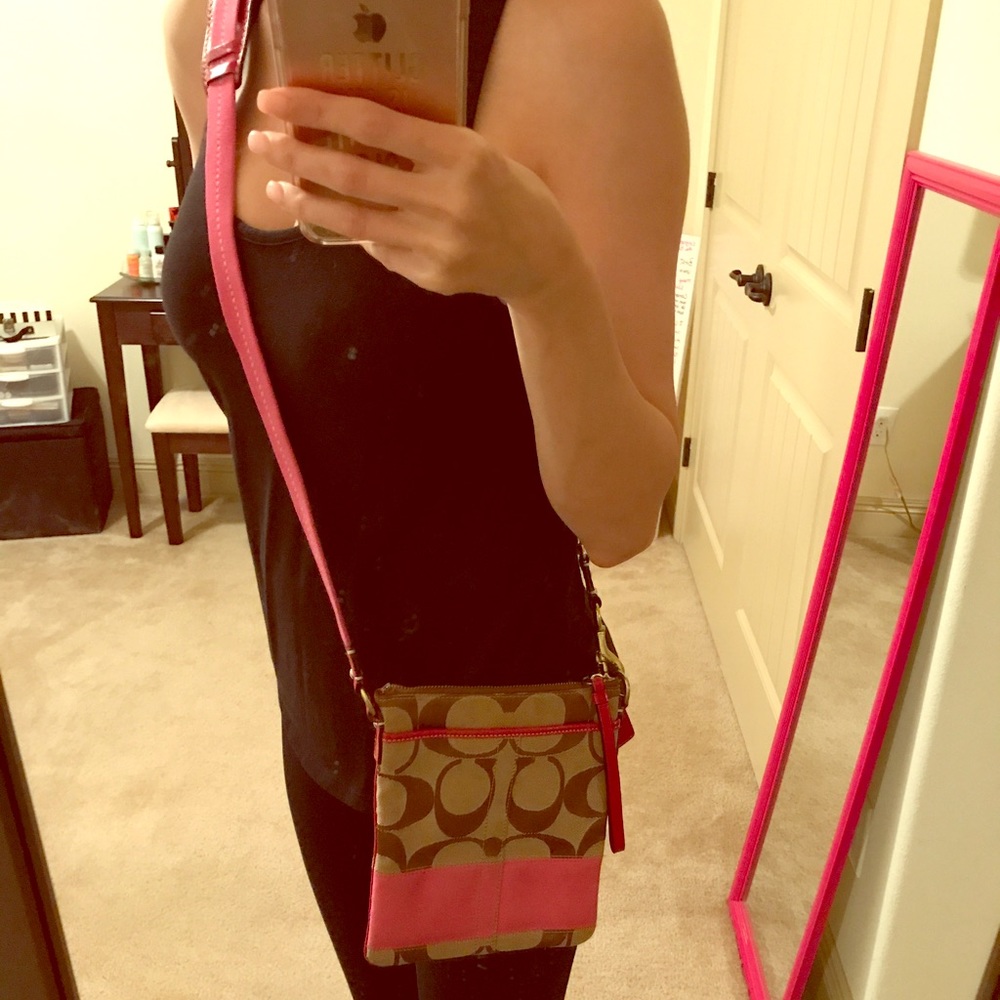 Pink and cream coach cross body purse.