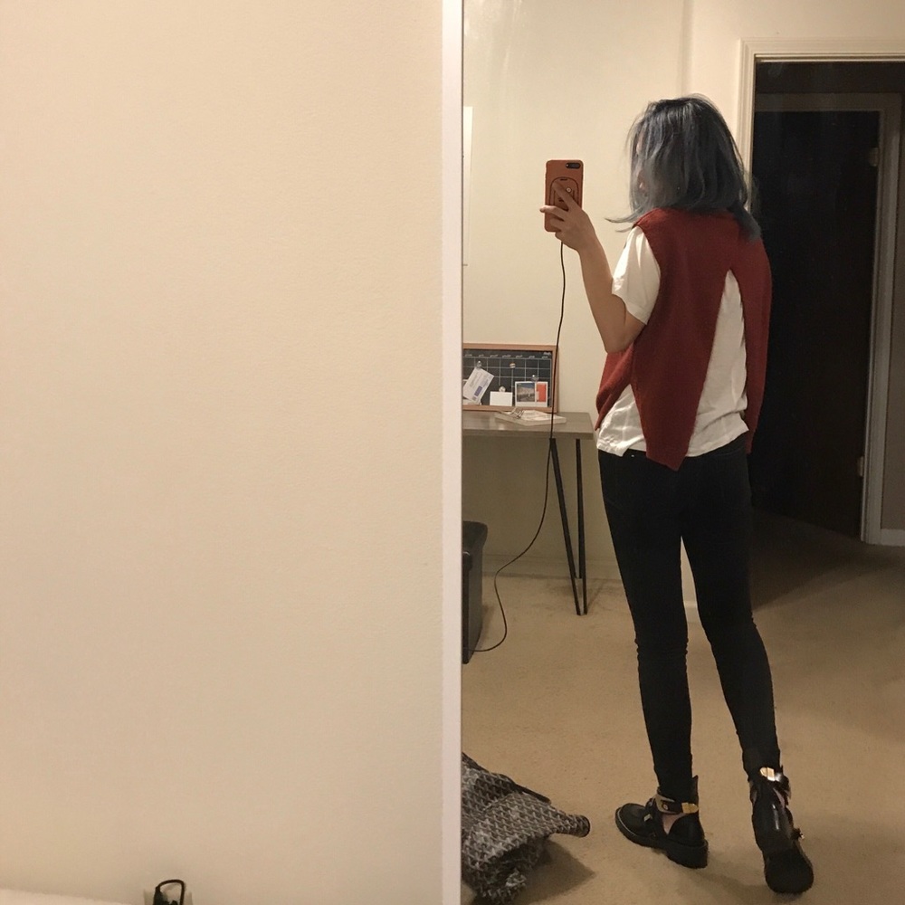 Open back sleeveless sweater.