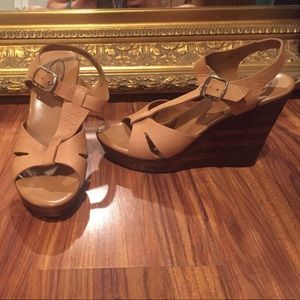 Like new tan with wooden heel wedges Like new tan with wooden heel wedges