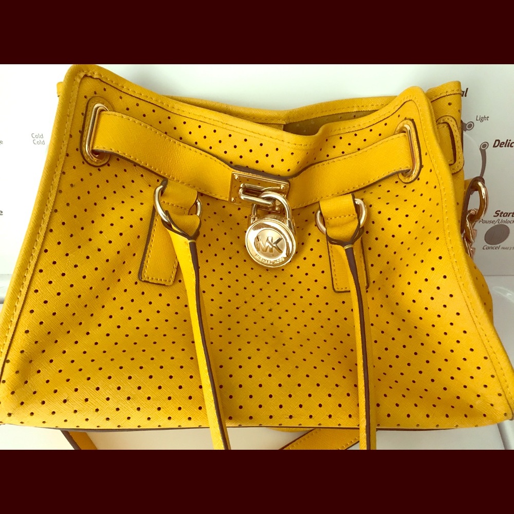 Yellow Michael Kors purse. With MK bag protector