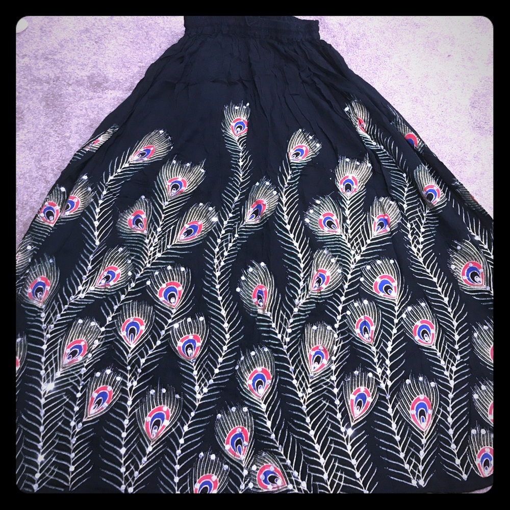 Black long skirt with peacock feathers designs