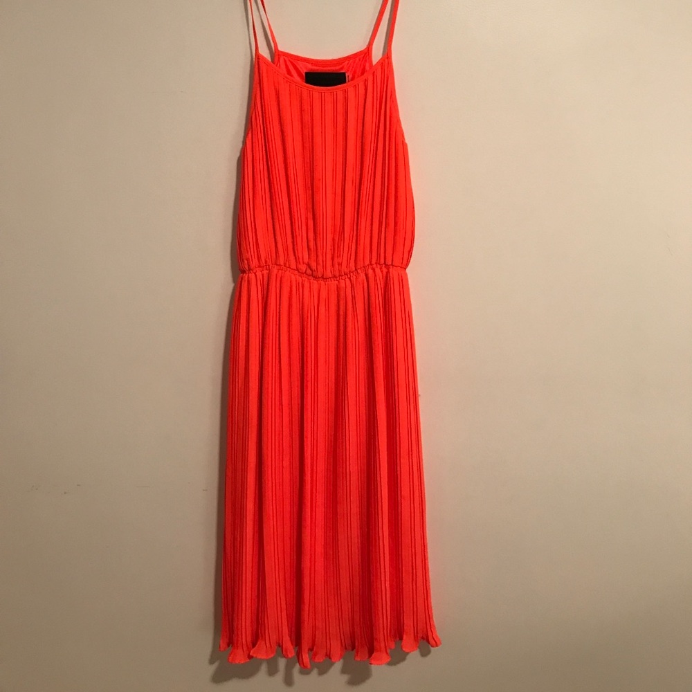 Bright orange pleated midi