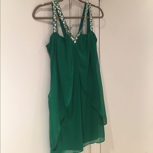 Green cocktail dress with rhinestones.