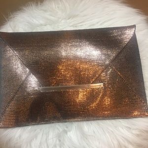 Beautiful rose gold BCBG Clutch. Like new!