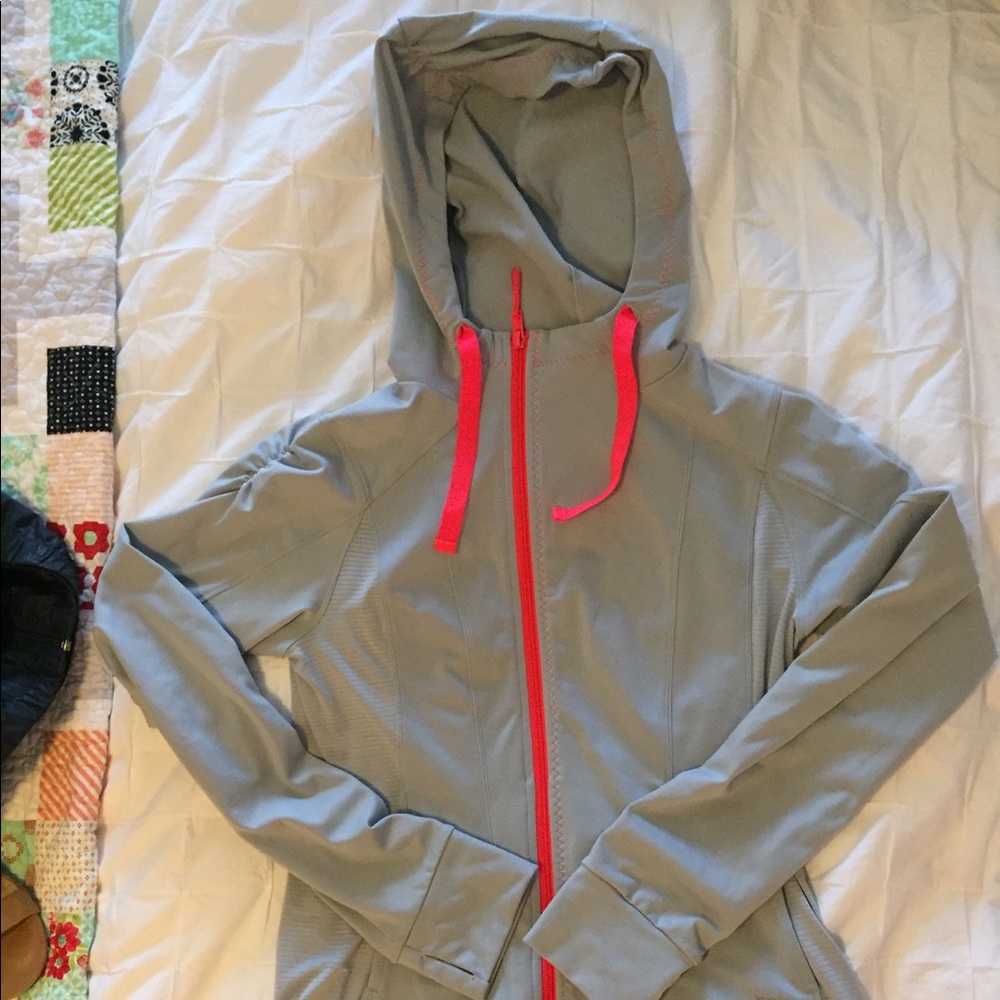 North face zip up. Gray and coral. Very comfy.