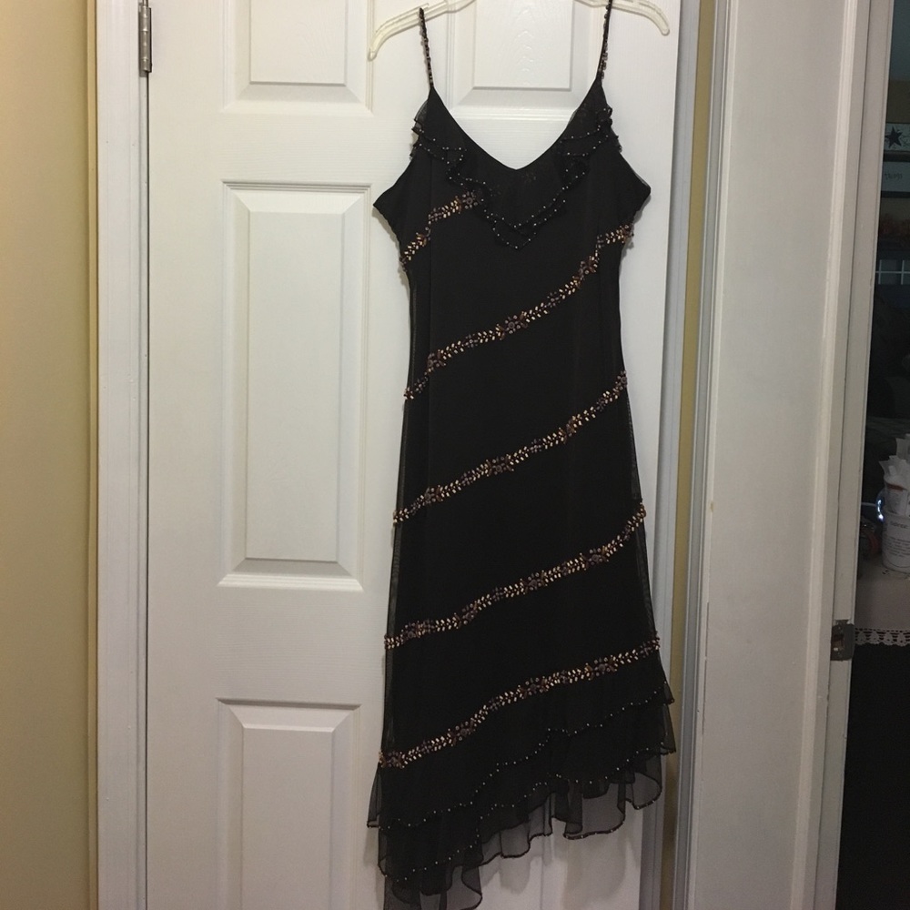 Spaghetti strap dress with asymmetrical hem