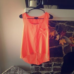Orange scoop neck sleeveless hem shirt