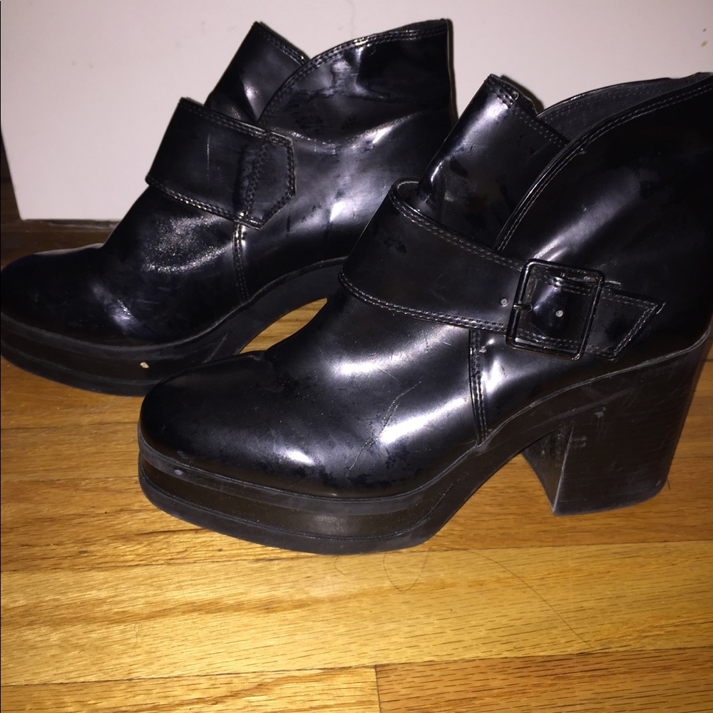 Black heeled buckled boots
