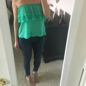 Green sleeveless blouse