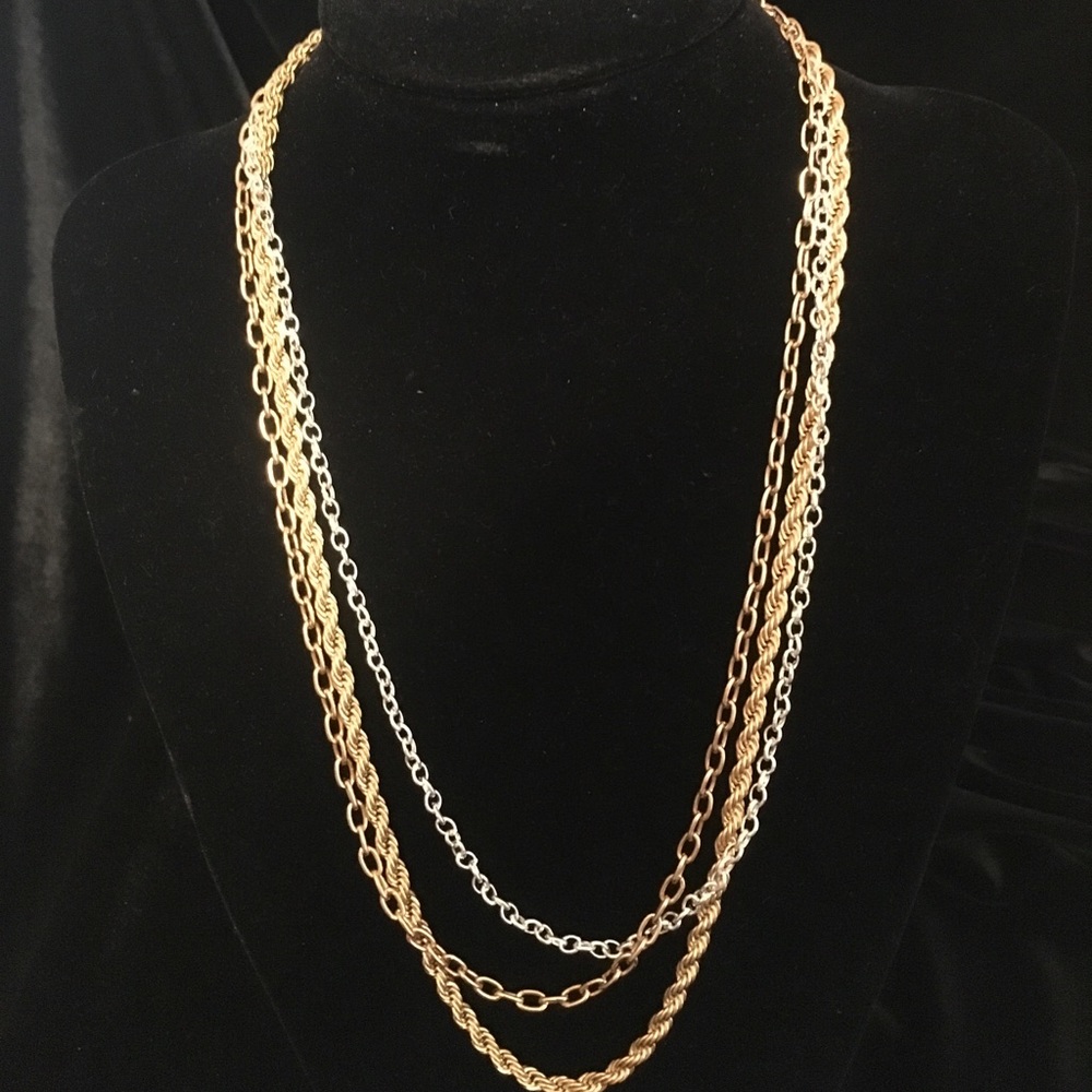 Triple chain two gold tone  one silver tone