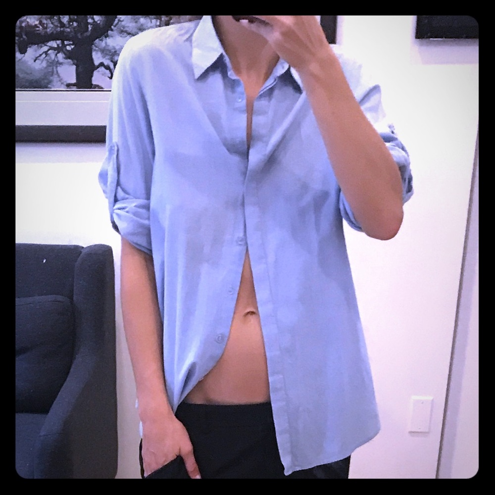 Blue cotton button up blouse with slit in back