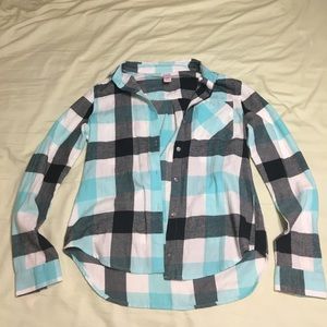 A blue white and grey flannel long sleeve shirt