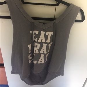 Grey hooded tank that says EAT PRAY SLAY