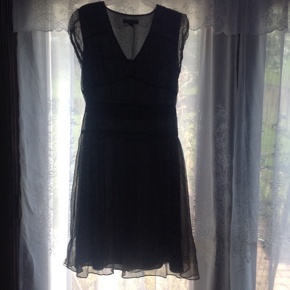 100 % polyester, 100% silk lined size 10 dress.