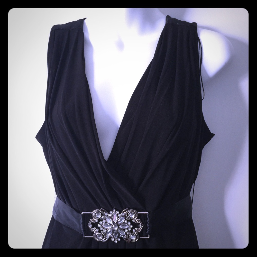 Black evening dress with decorative broach