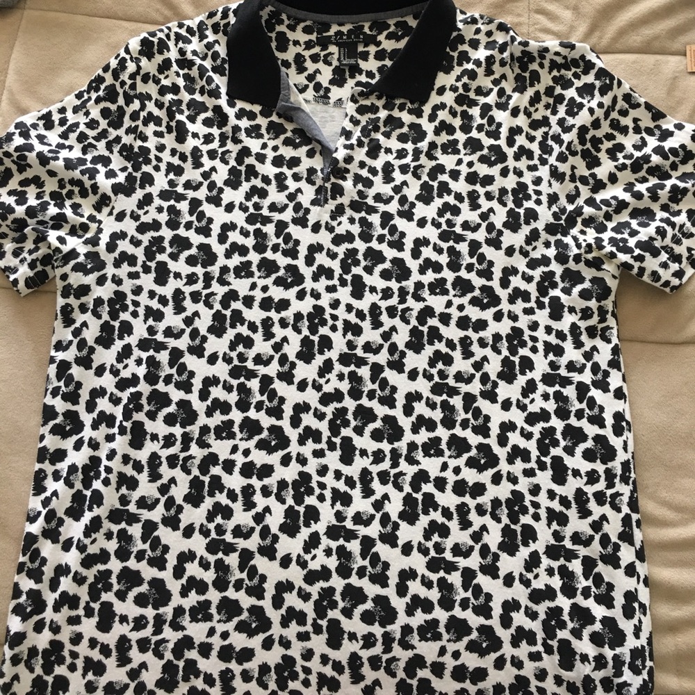 Men's polo white and black leopard shirt.