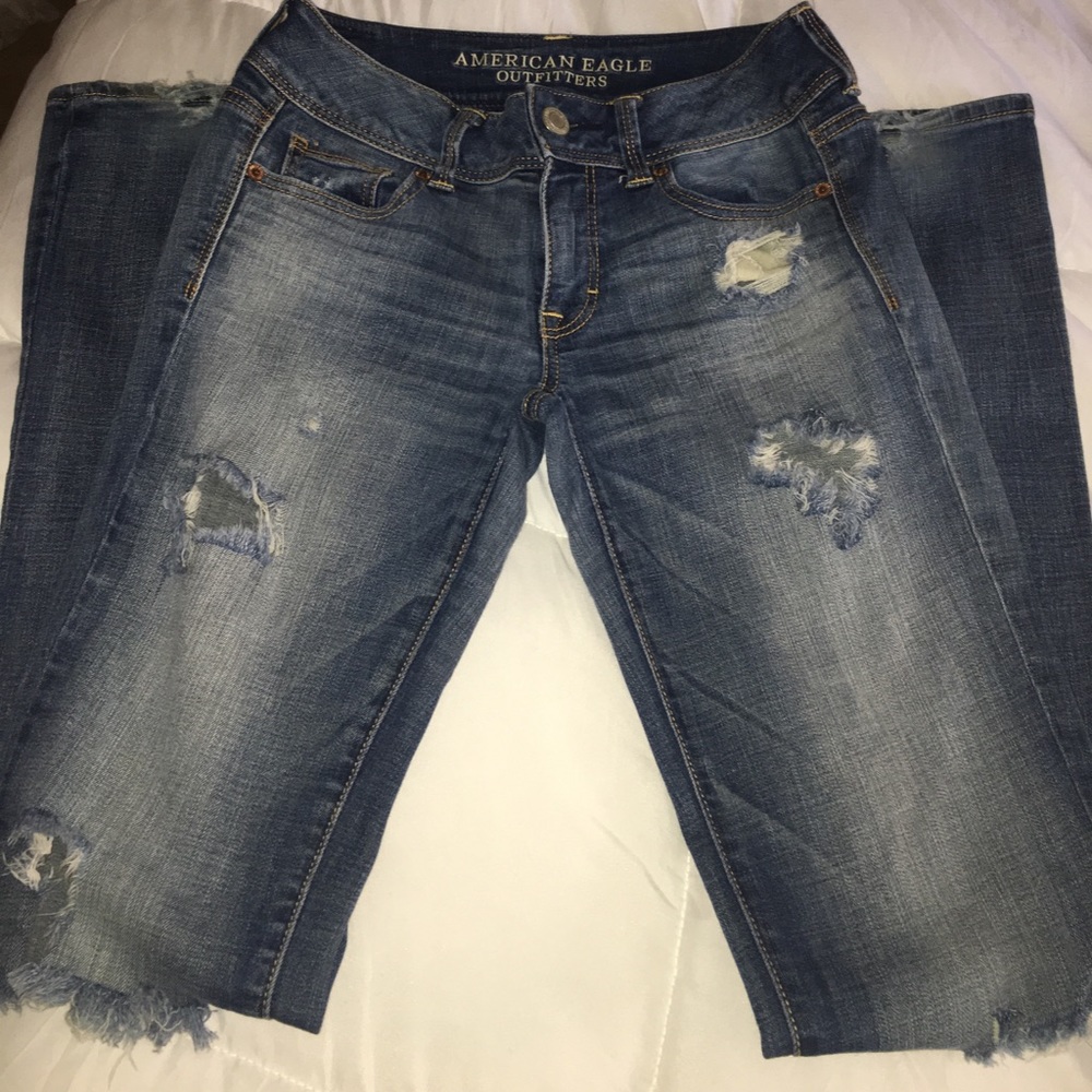 Women's destroyed kick boot super stretch jeans