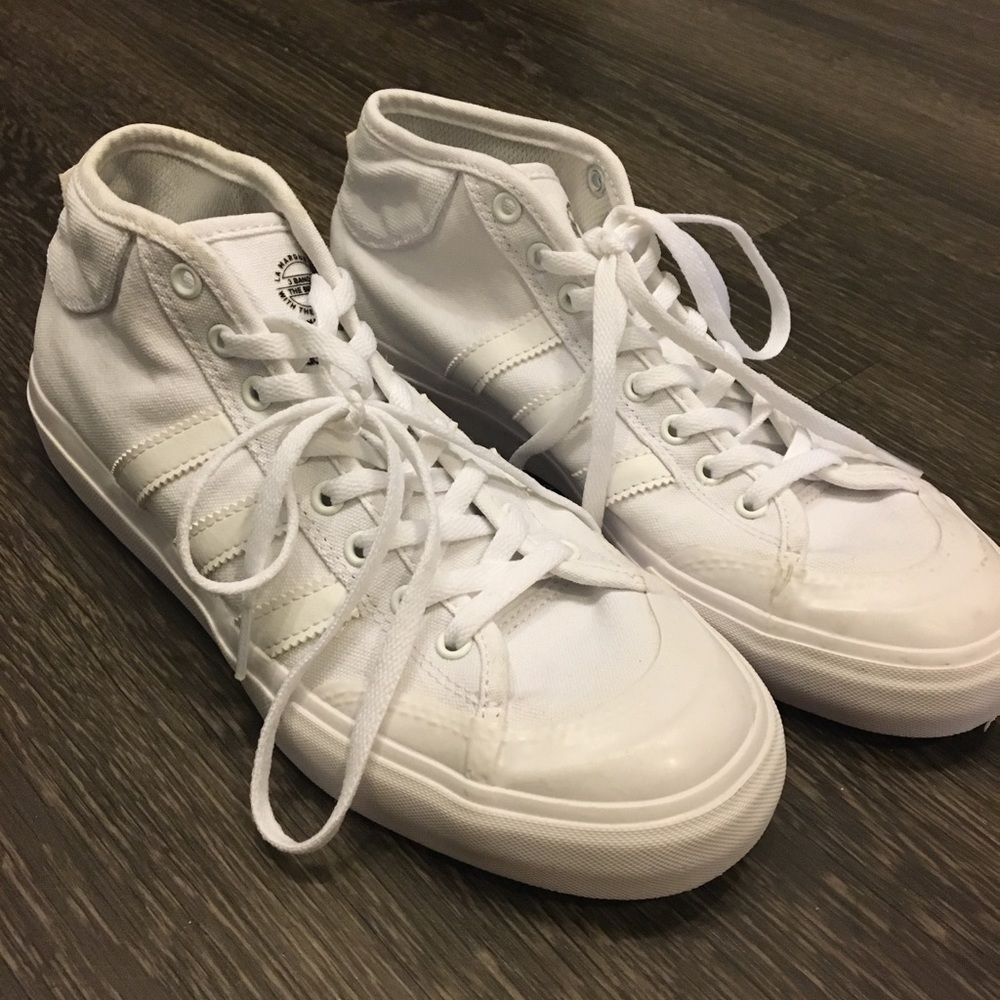 All white Adidas high top sneakers
