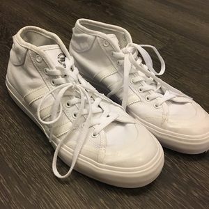 All white Adidas high top sneakers