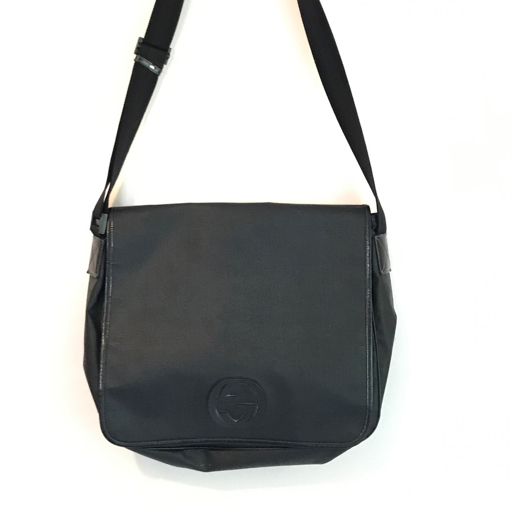 Authentic Gucci canvas messenger bag.