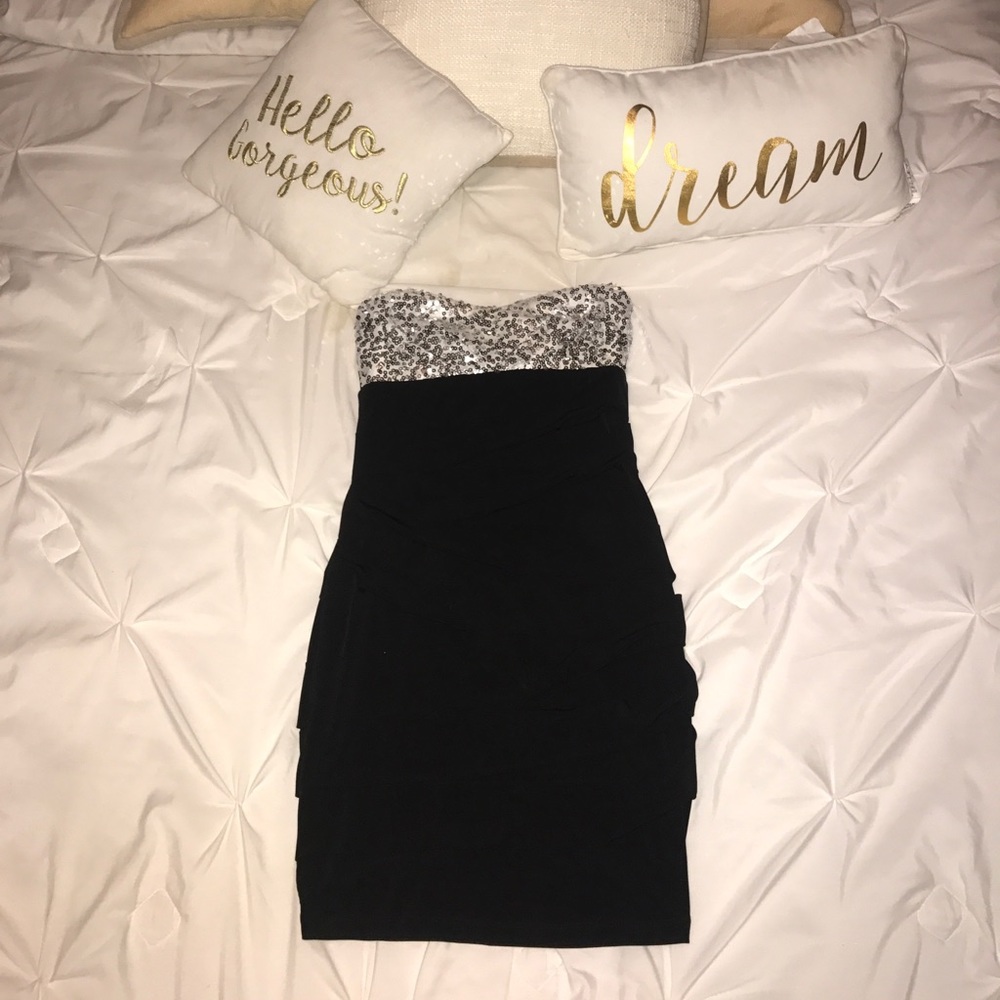 Strapless form fitting black and silver dress