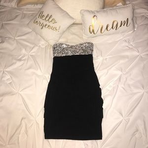 Strapless form fitting black and silver dress