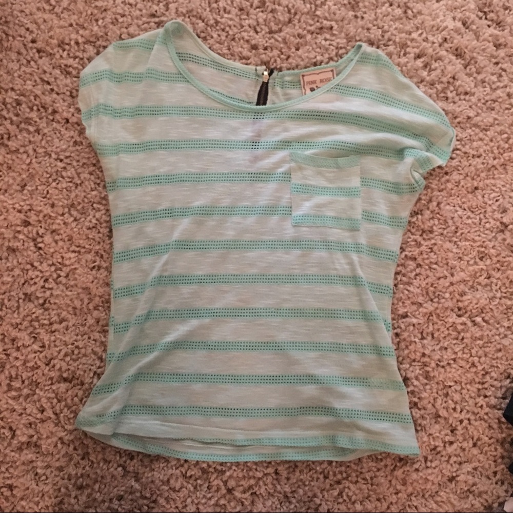 Teal colored shirt with zipper in the back.