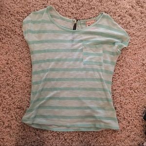 Teal colored shirt with zipper in the back.